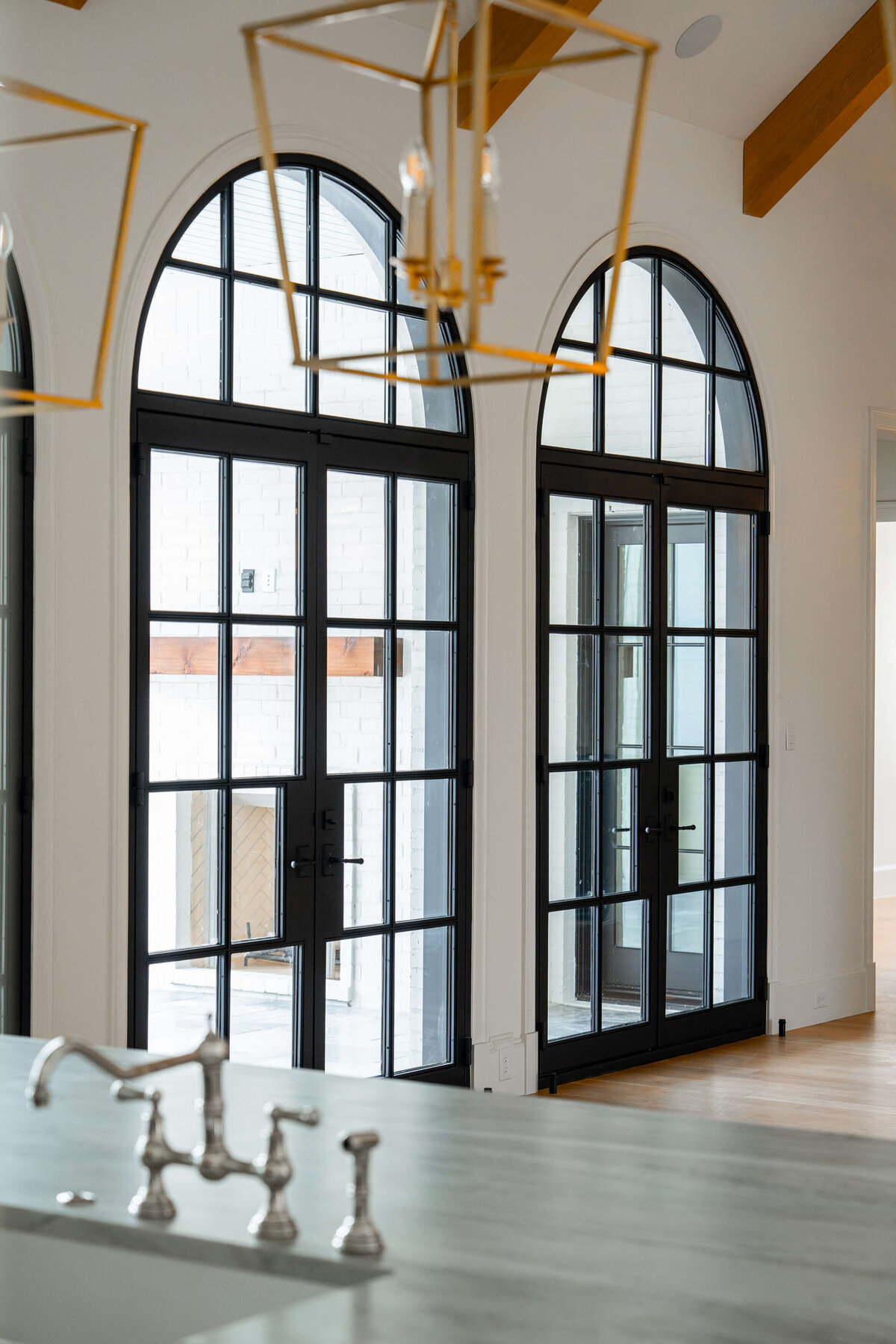 Custom arched doors in luxurious Colleyville home