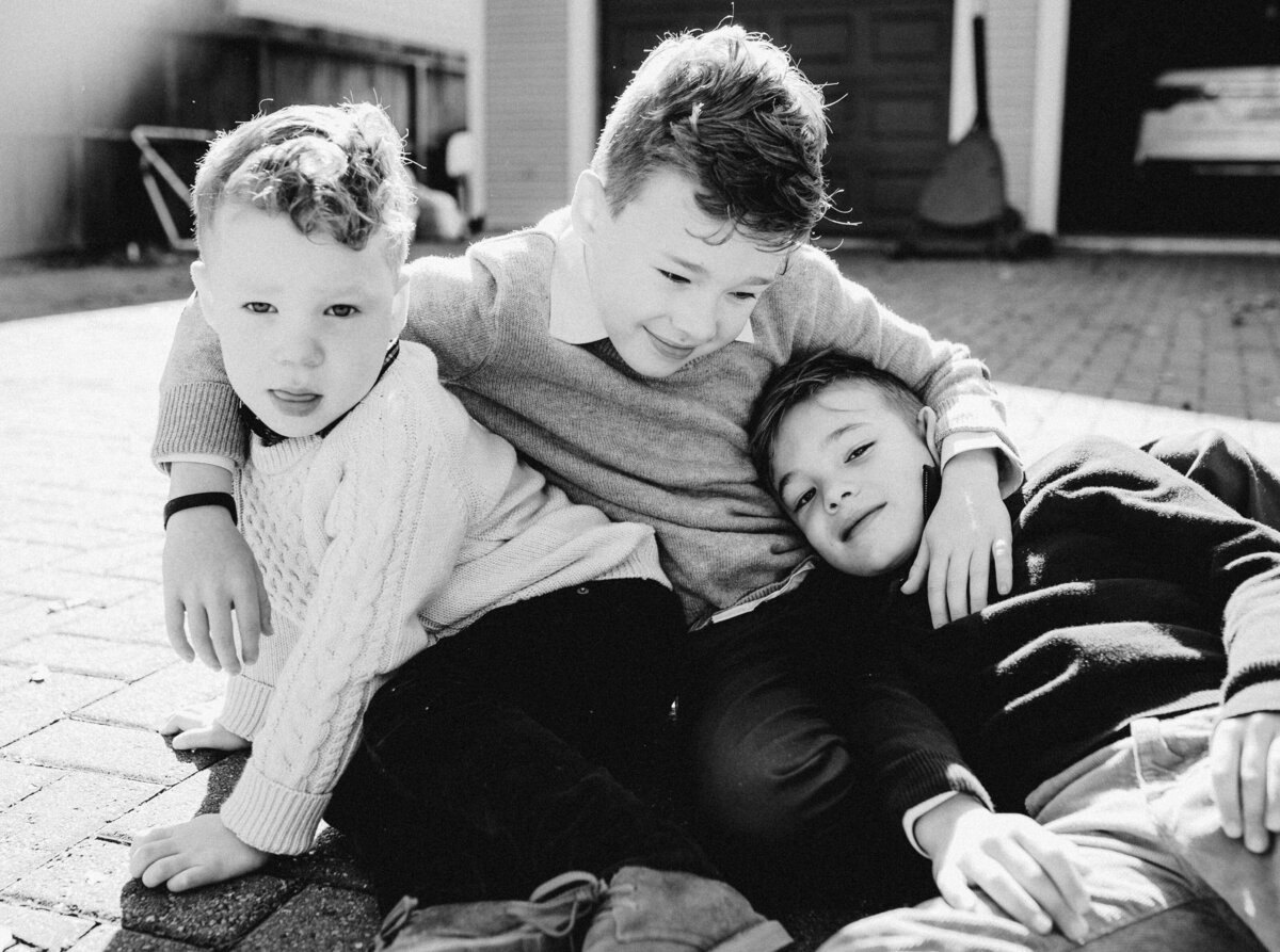 Three kids sitting on ground at Austin family photo session