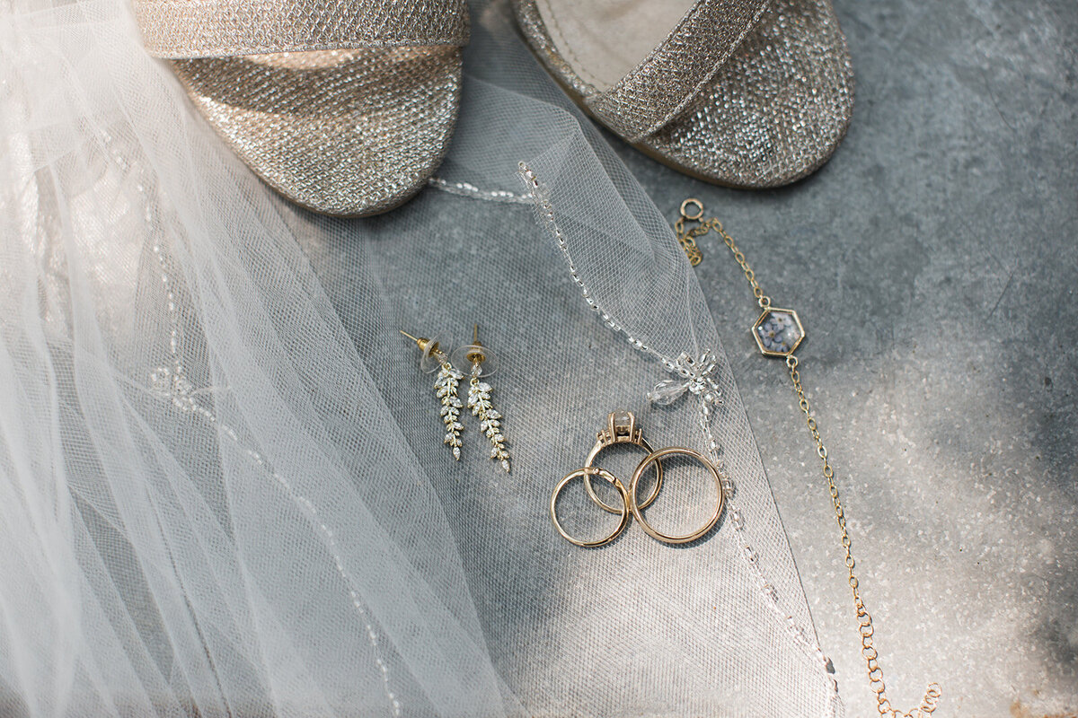 Close up of bride's shoes and jewelry