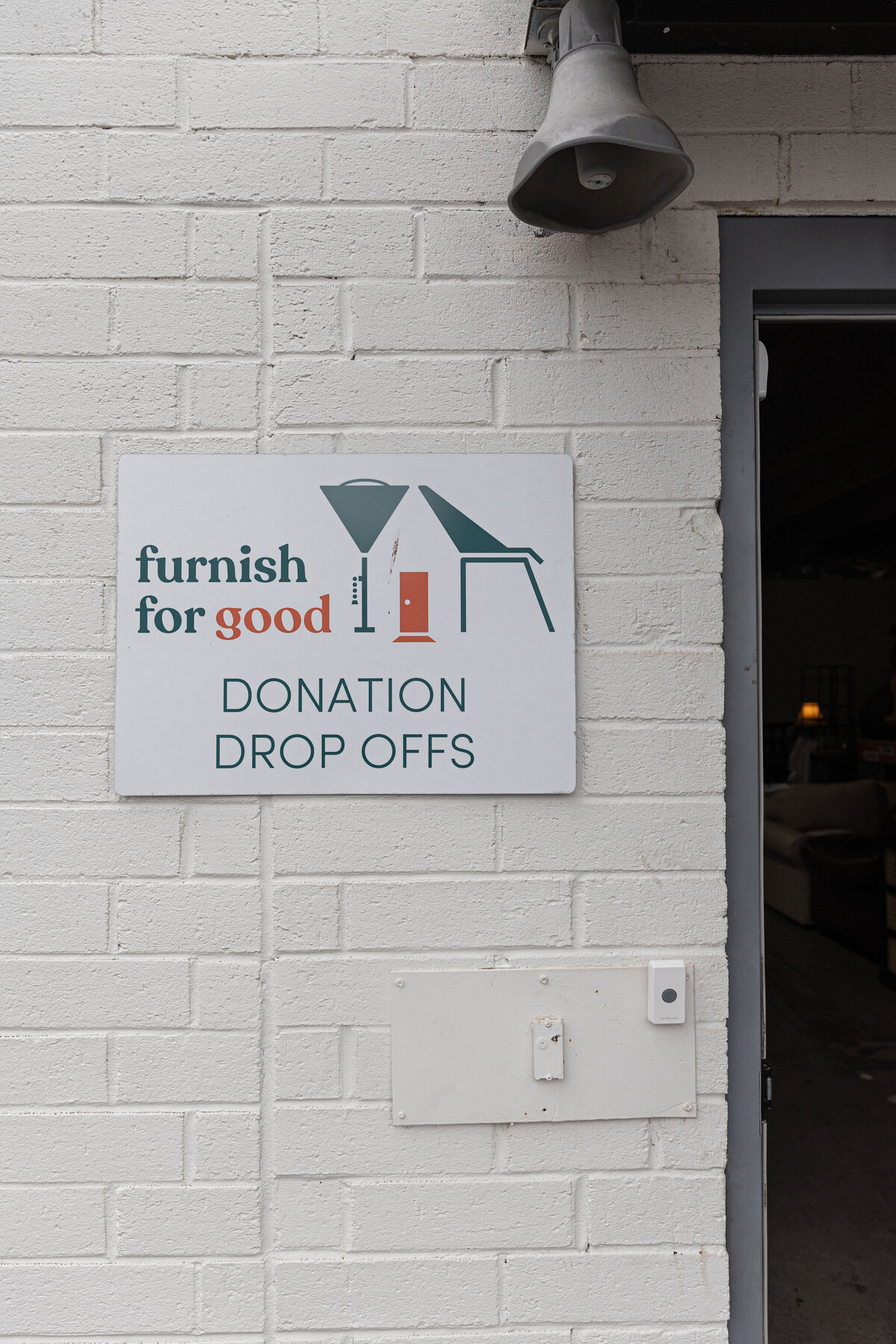 a donation drop off sign on the side of a building