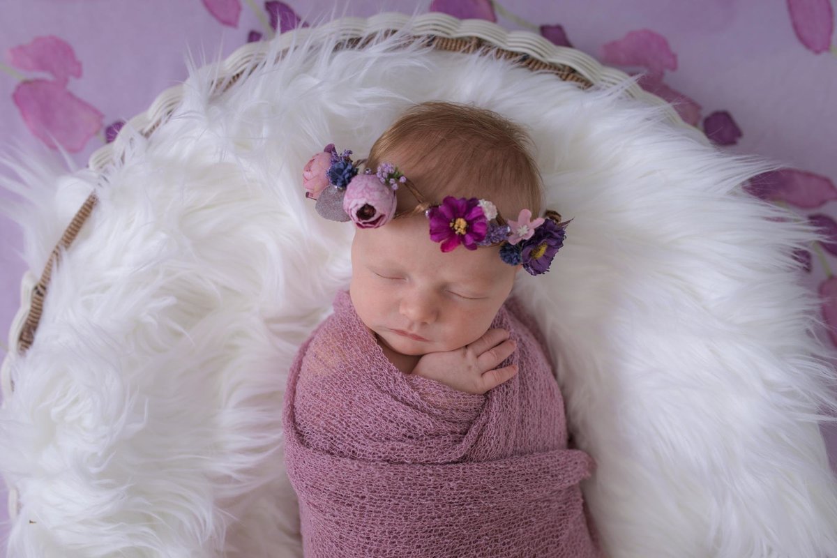 newborn girl with floral crown