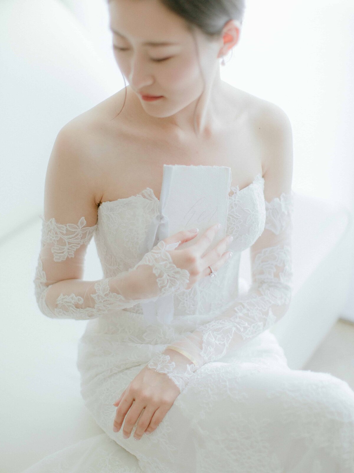 Bride in wedding gown with makeup by MAP