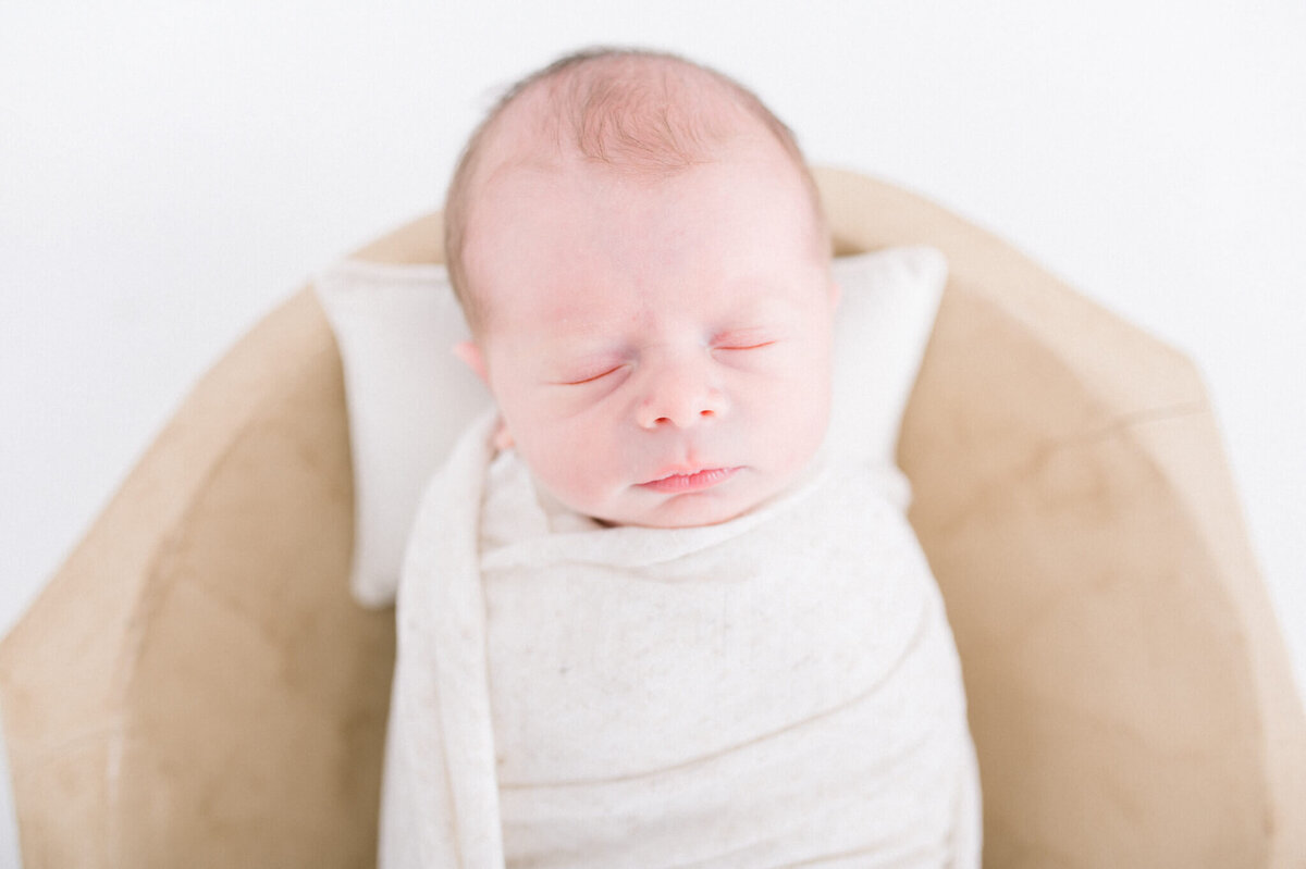 Niagara newborn photography of a baby boy in a bowl