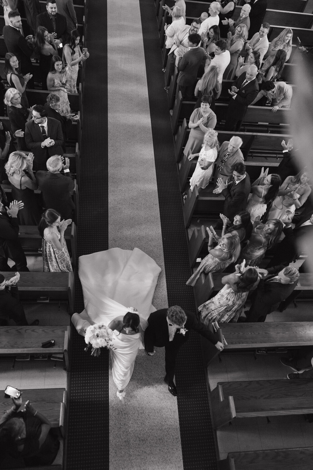 bride and groom walking down the isle at church wedding in connecticut 
