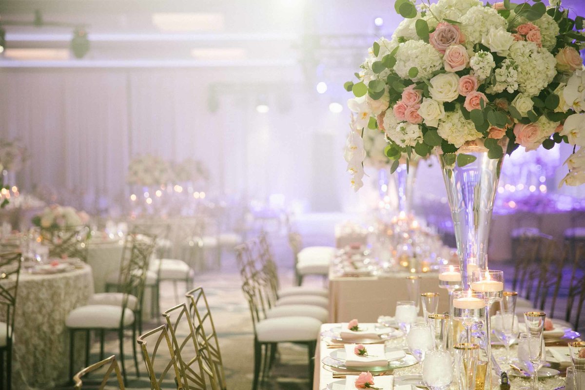 Grand ballroom wedding reception in Seattle with tall blush and cream floral
