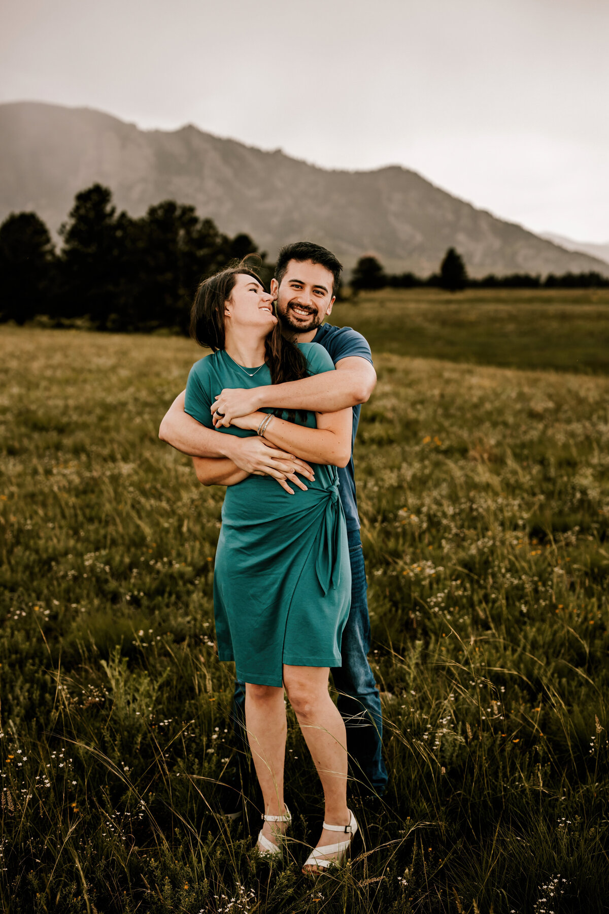 Colorado couple hold eachother in the middle of fall foliage for a couples session