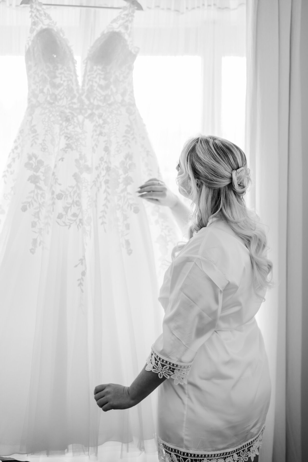 Bride in Canberra looking at her wedding dress