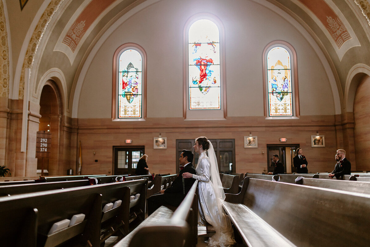 a bride and groom inside a church