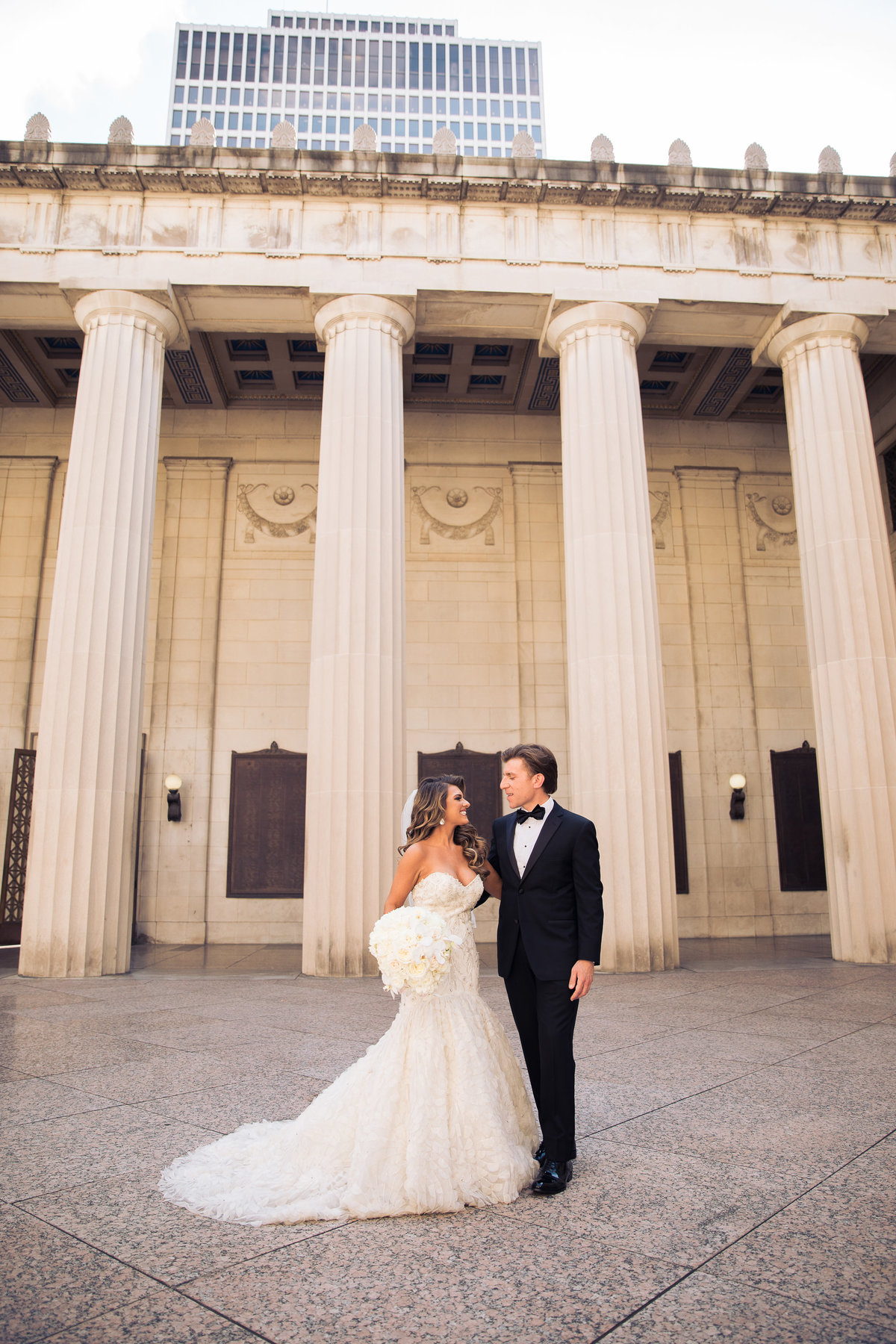 Bride and Groom in front of the columns at War Memorial.