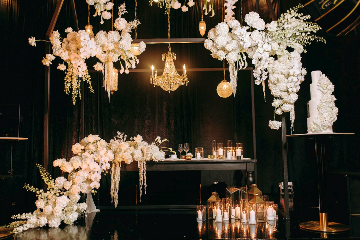 black-white-gold-wedding-reception-sweetheart-table-flowers-chandeliers