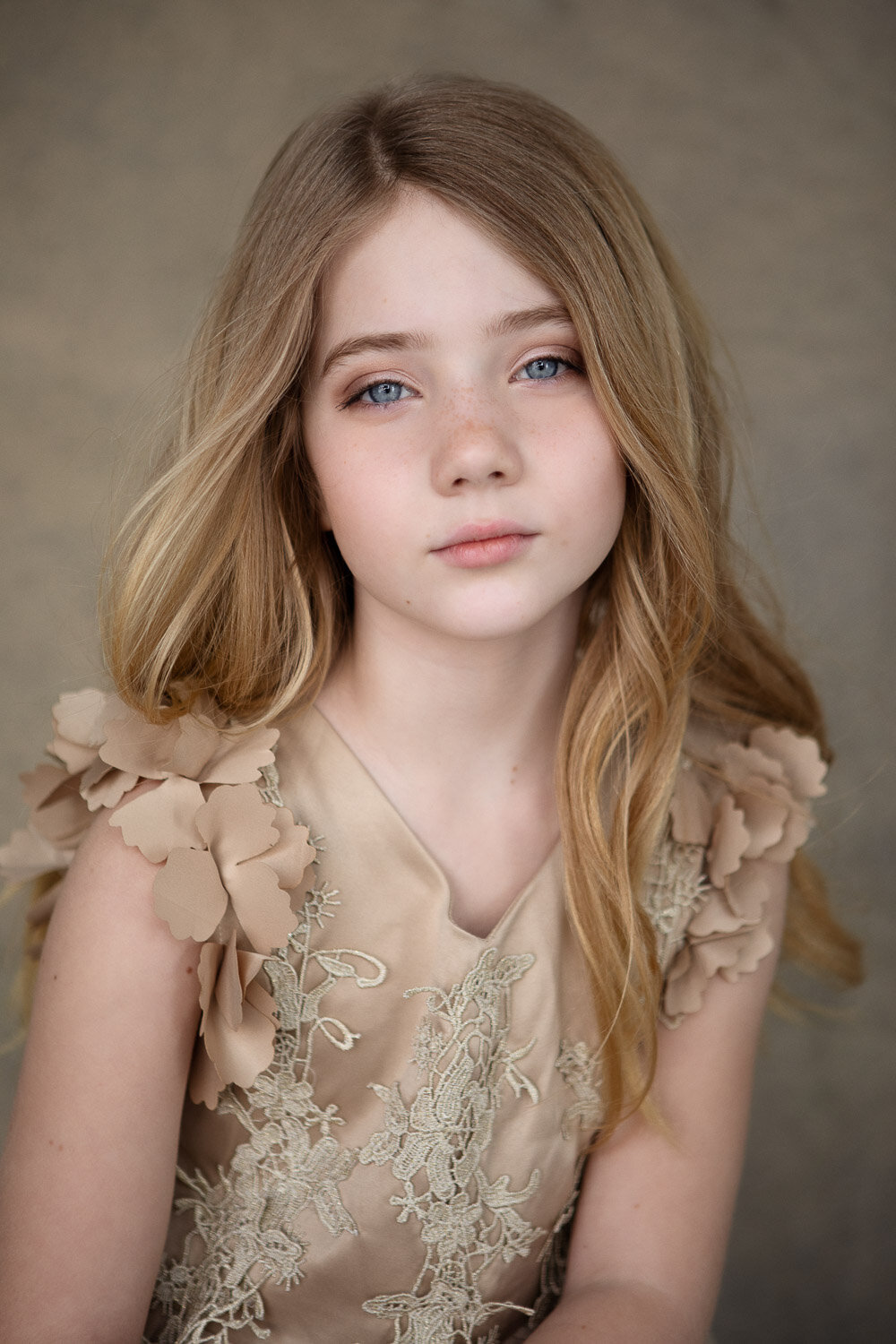Professional little beauty portrait of girl in gold dress in Buffalo, New York