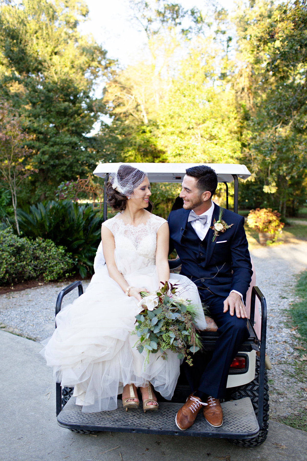 cute wedding couple on a golf cart