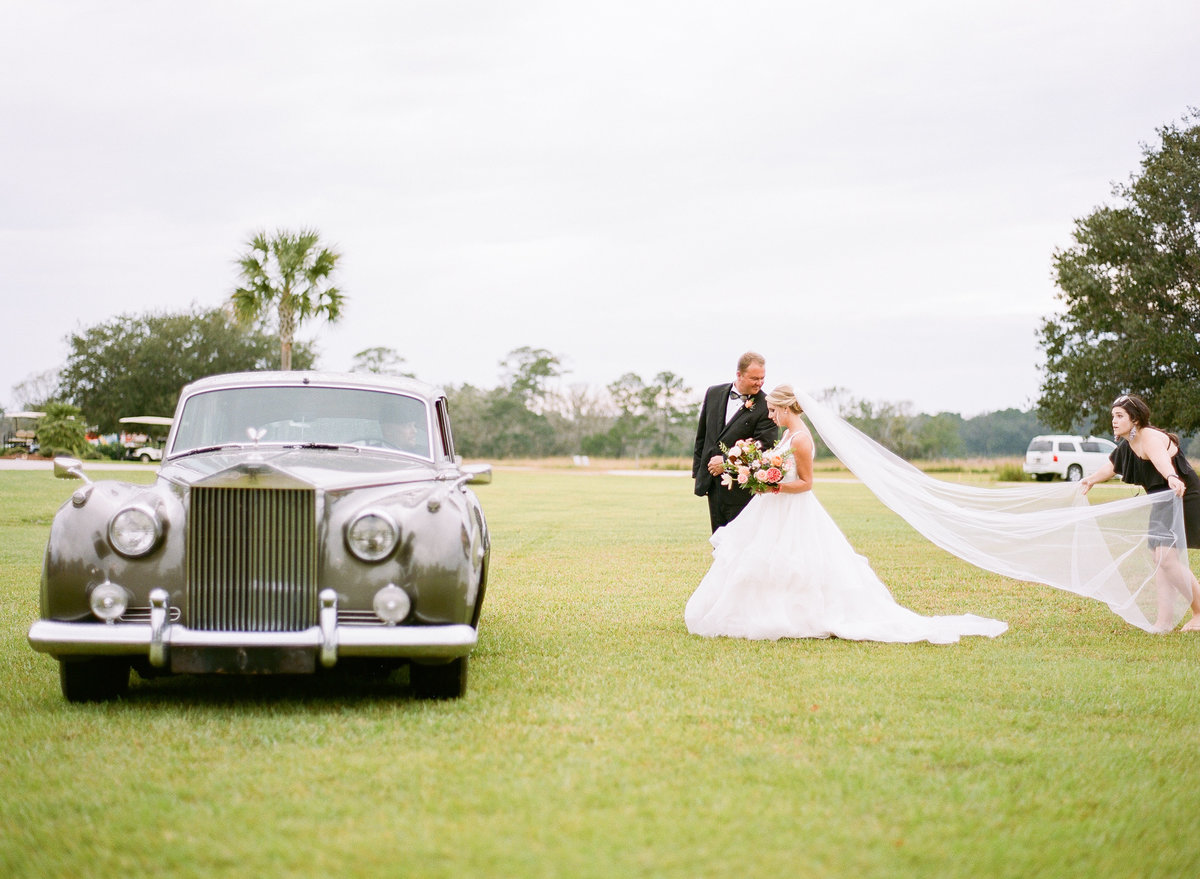 Bride and Dad head to Charleston Wedding Ceremony Long cathedral length veil Entrance with 1961 Grey Rolls Royce