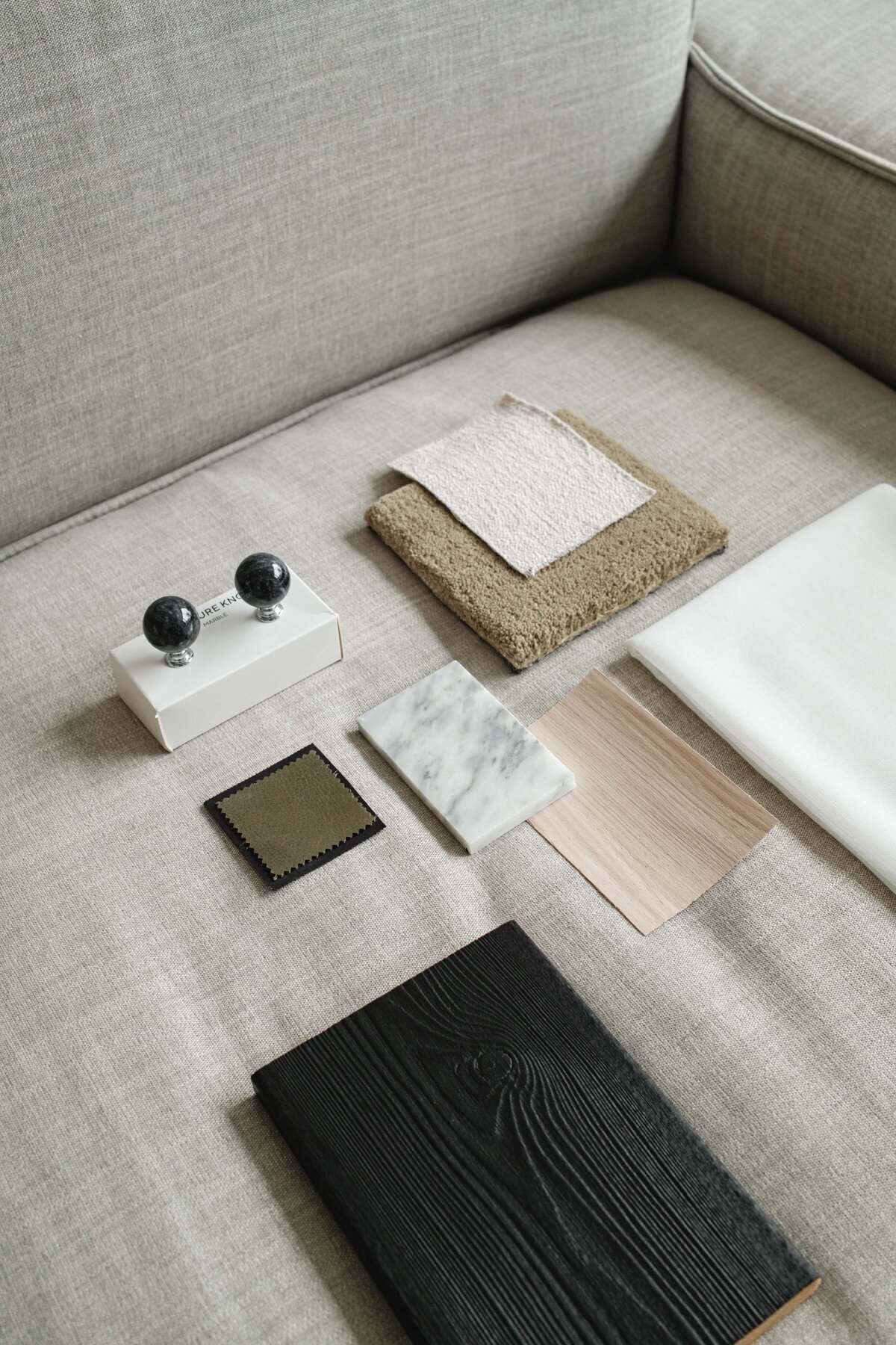 kaboompics_interior-design-material-board-home-styling-a-neutral-color-scheme-fabric-samples-35119