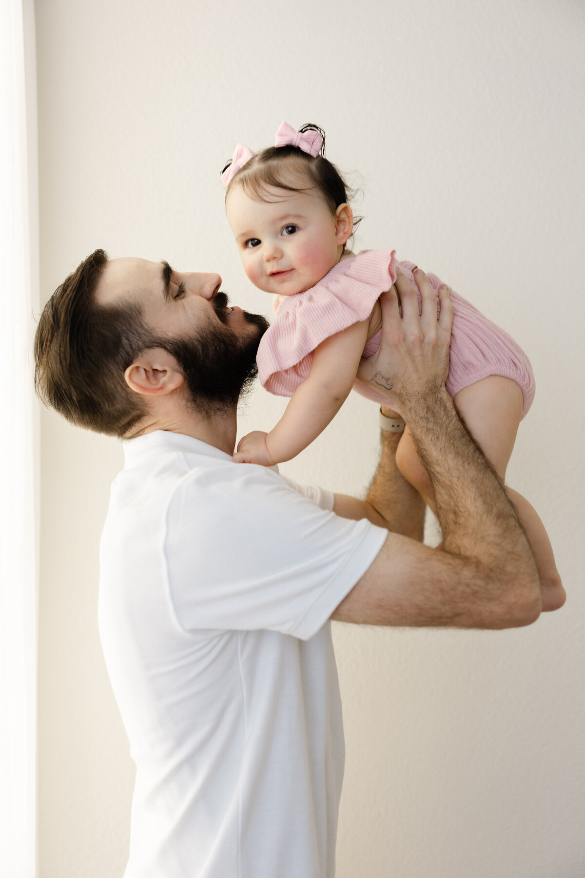 A daddy’s love and a first birthday kiss is nothing sweeter. Captured by Yucaipa cake smash photographer Kaitlyn Dawn Photography