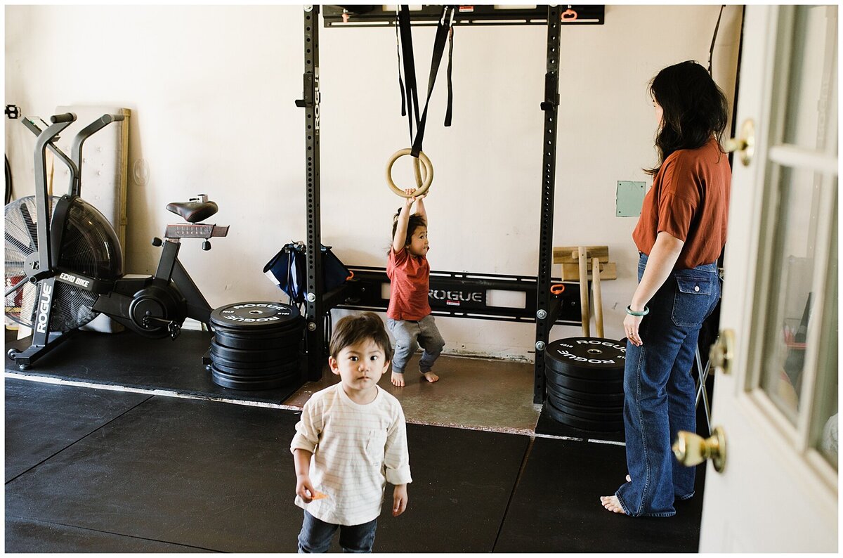 two children and mother in a workout room at family photo session in Austin by Amber Vickey Photography