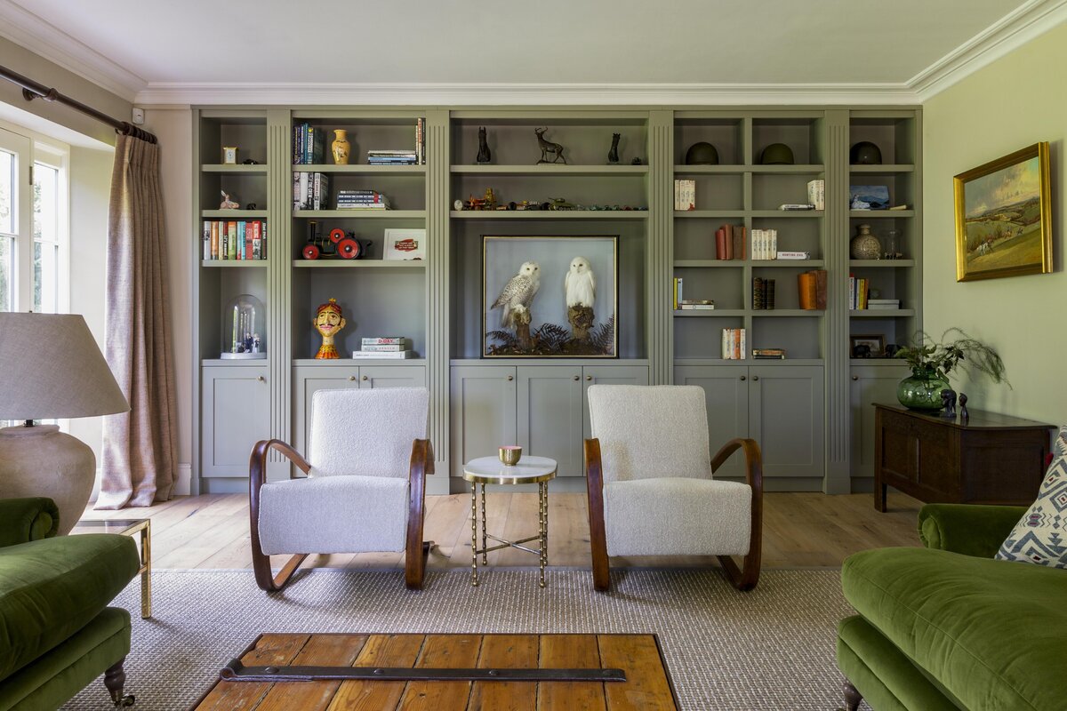 Library with large bookshelves and custom furniture