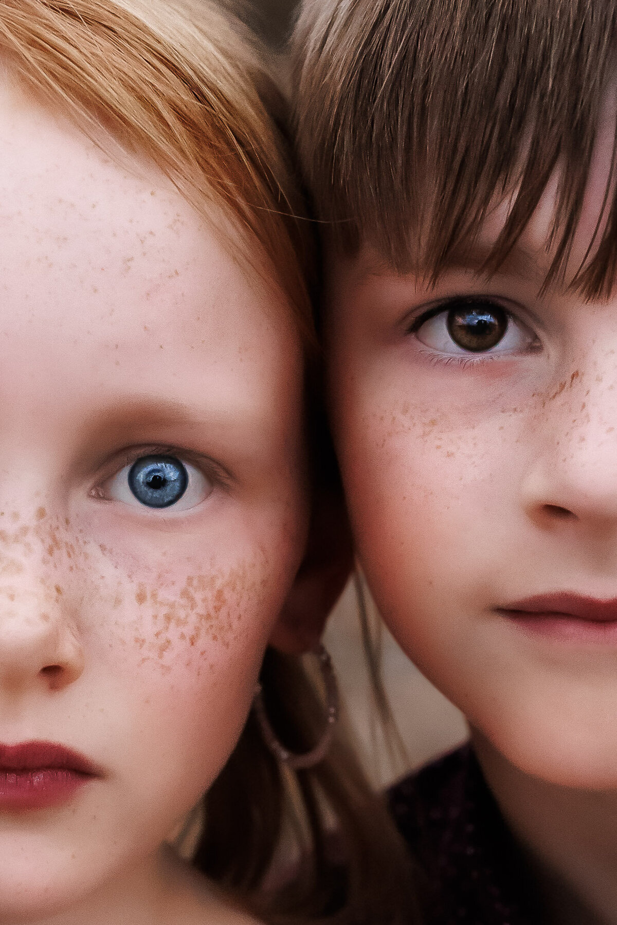 close up freckled siblings with red hair