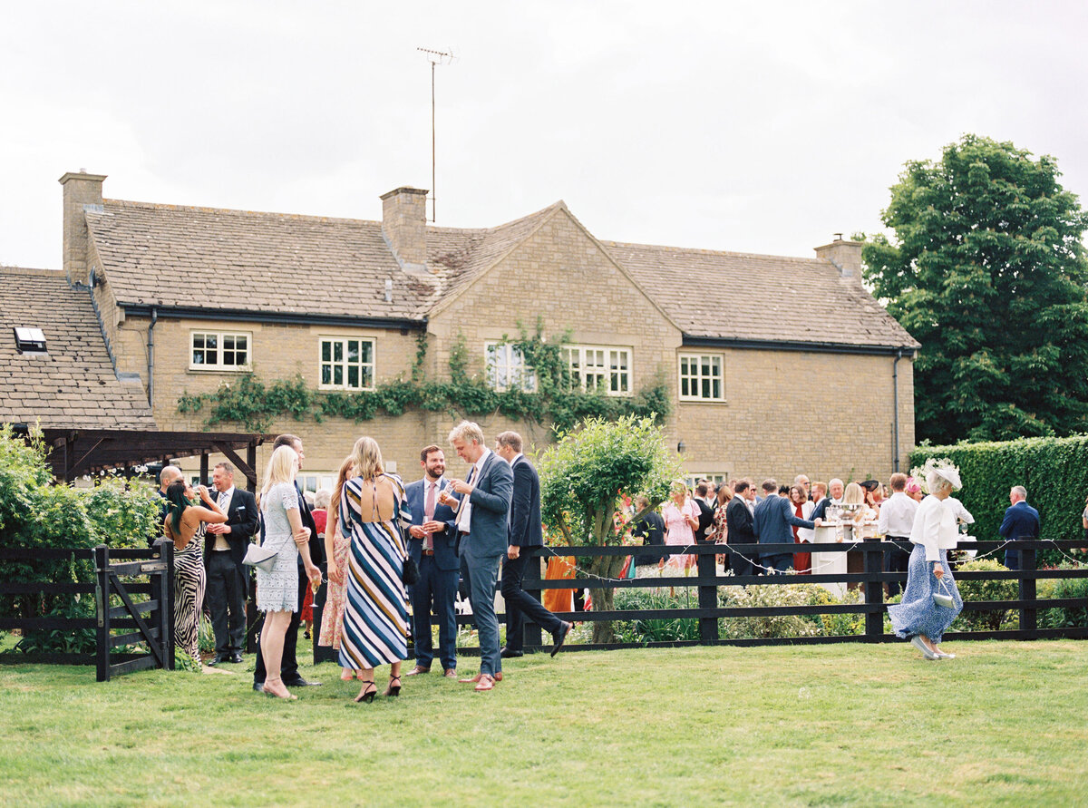 wedding guests enjoying drink reception before wedding breakfast at the private property