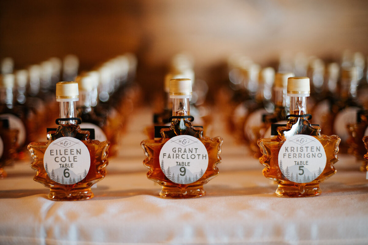 pure vermont maple syrup wedding favors on table at lake bomoseen lodge wedding in vermont