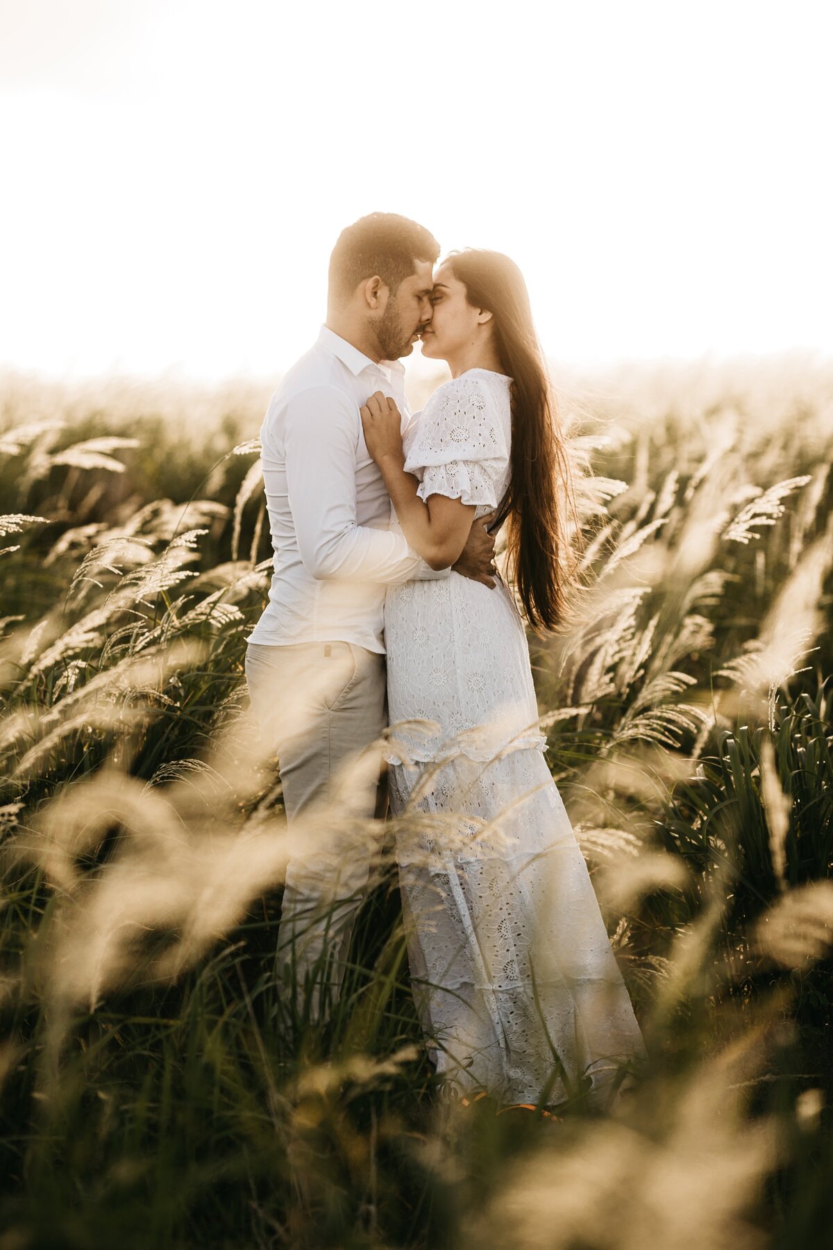 man-and-woman-kissing-on-grass-field-3534497
