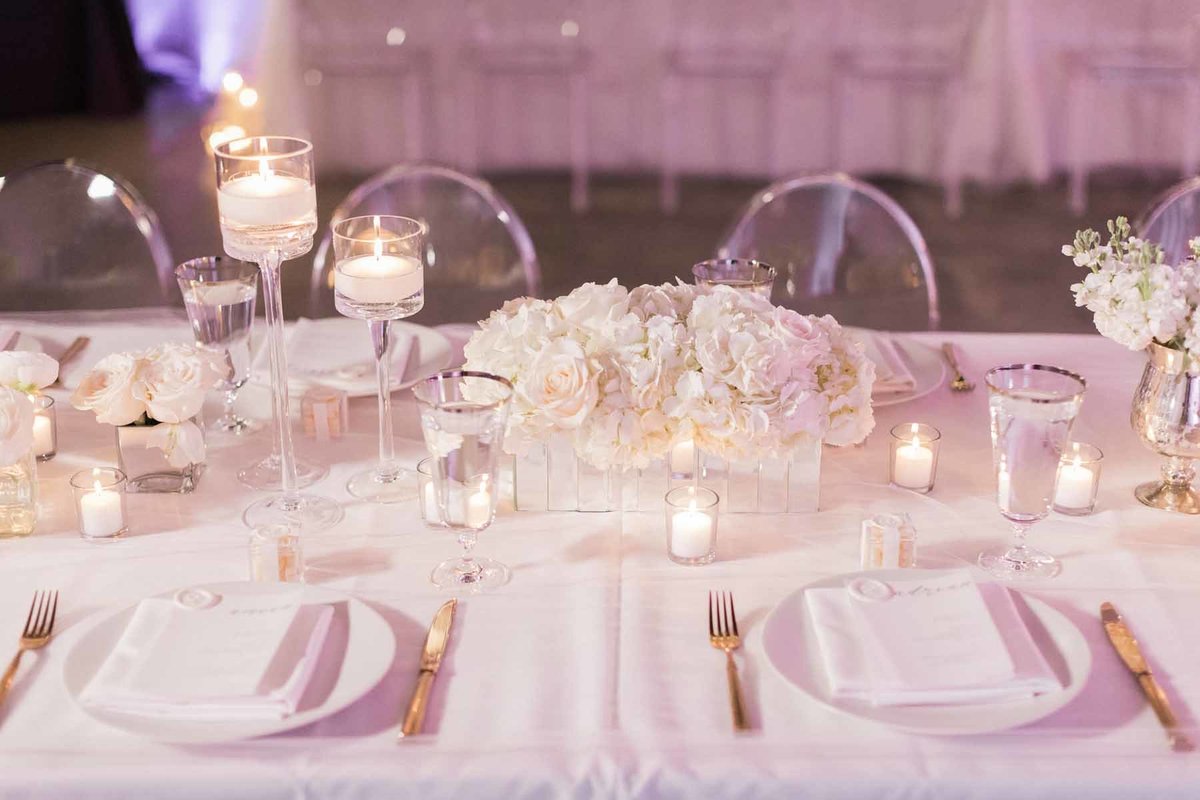 This all white table setting  is simple and elegant