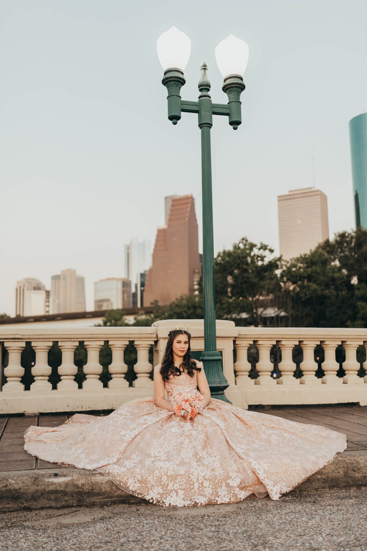 15 year old girl sits on street against city backdrop in Houston texas for Allyson blankenburg
