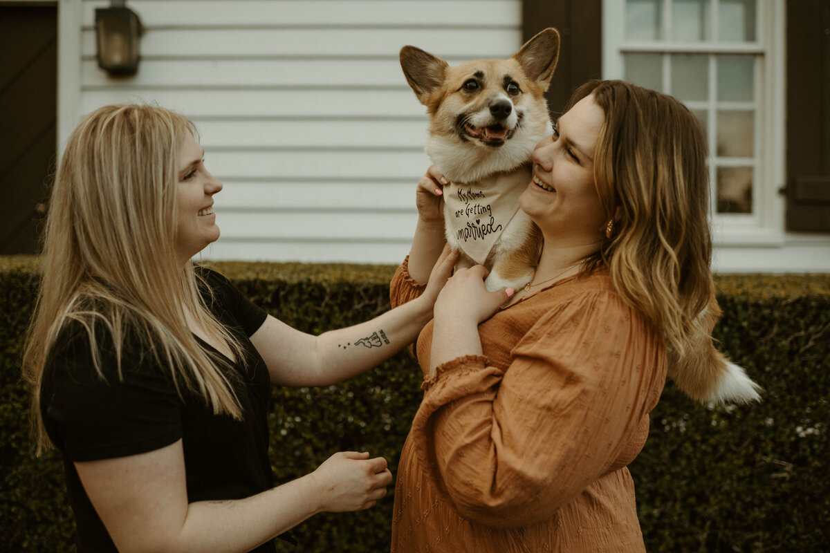 lgbtq+ couple include their dog during engagement session in colonial williamsburg
