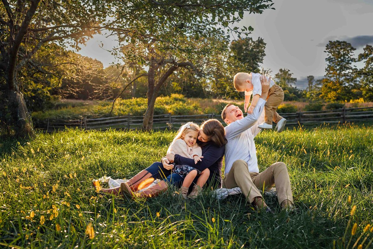 family playing in field sagamore hill photography