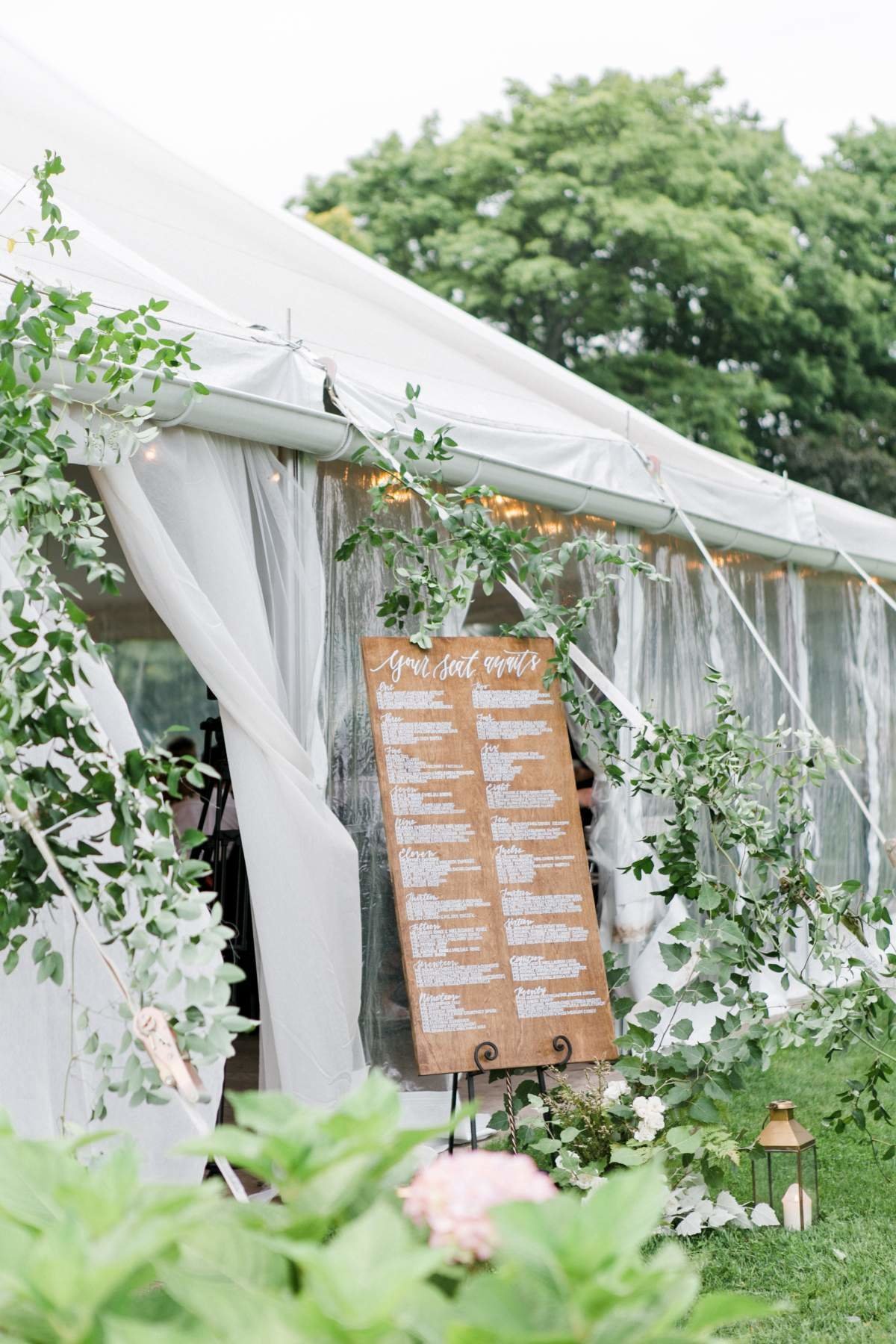 wedding-tent-entrance-with-greenery-welcome-sign