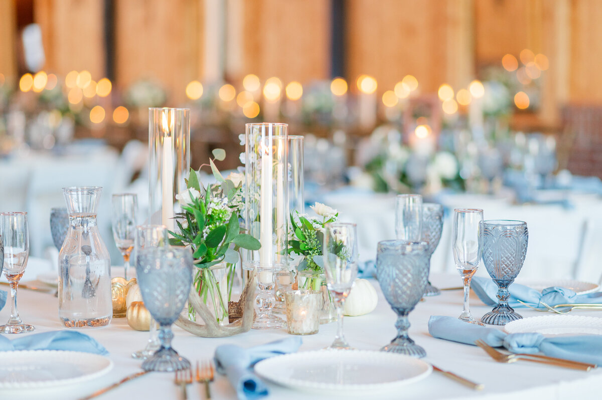 White and blue table decor at a wedding reception.