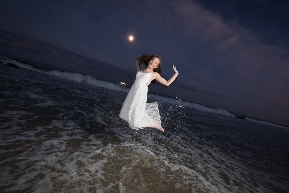 mitzvah-preshoot-asbury-park-girl-jumping-ocean-moonlight