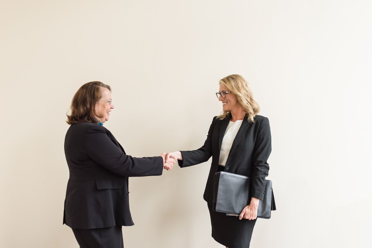 Nashville attorney shaking hands with a client in her law office at The Ralston Firm in Gallatin
