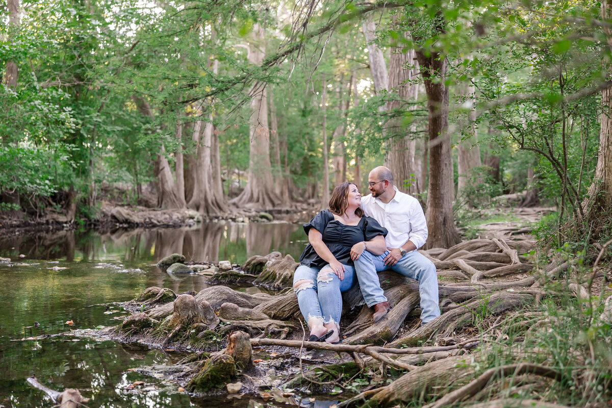 engagement session at Cibolo Nature Center in Boerne cypress tree roots by water by wedding photographer Firefly