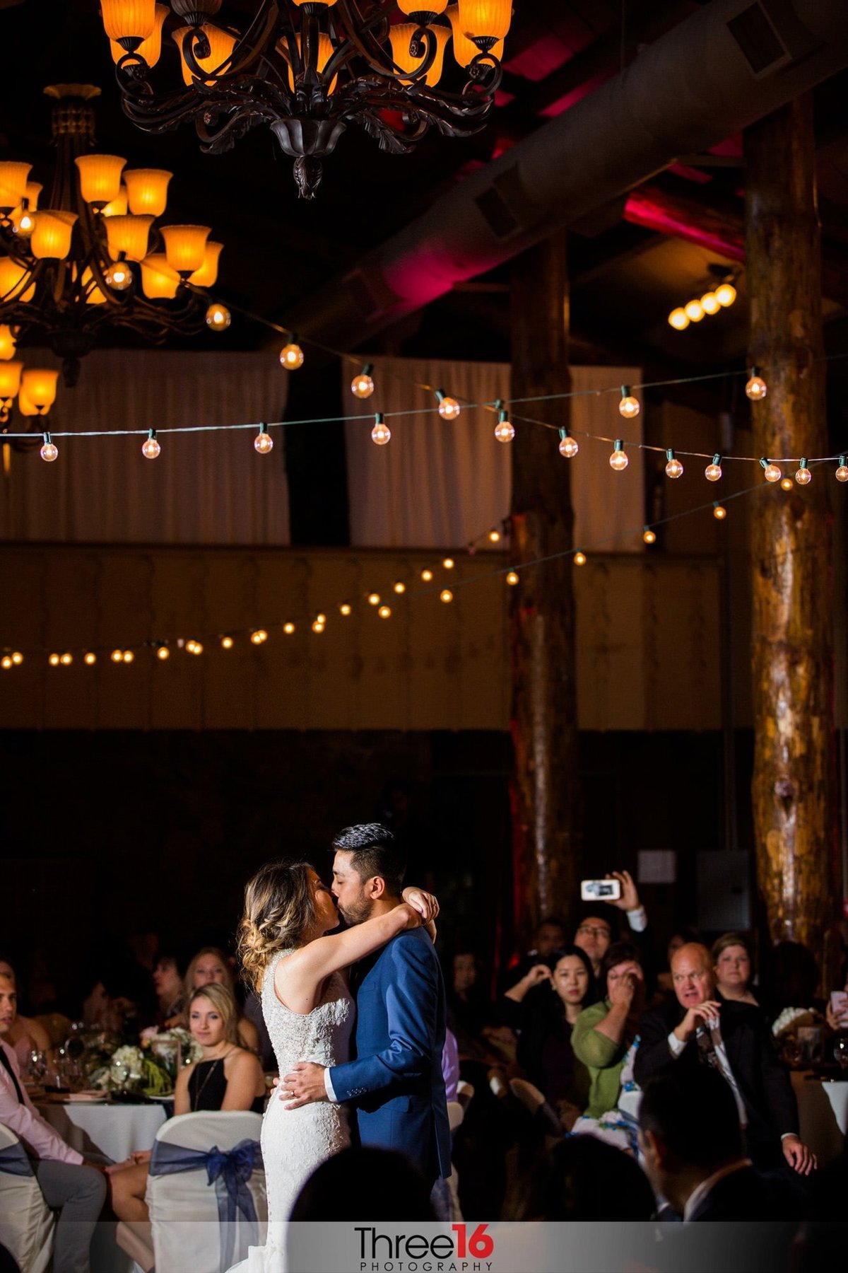 Bride and Groom kiss during their First Dance together