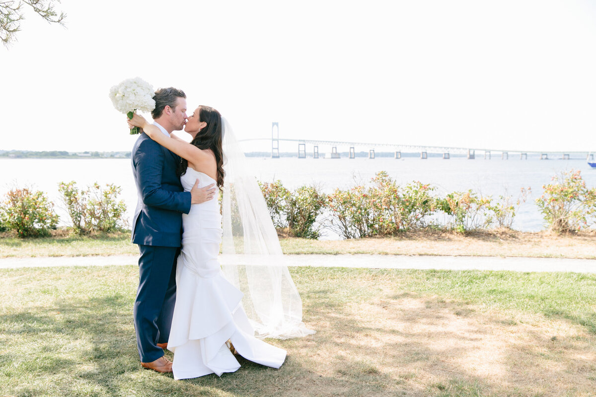 bride and groom embracing each other seaside Newport Rhode Island