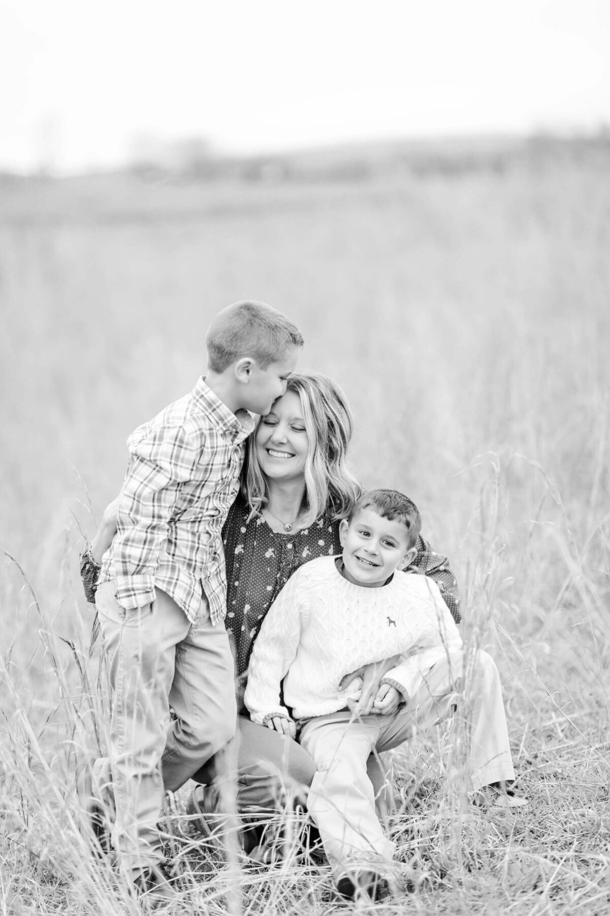 black and white portrait of mom and her two sons