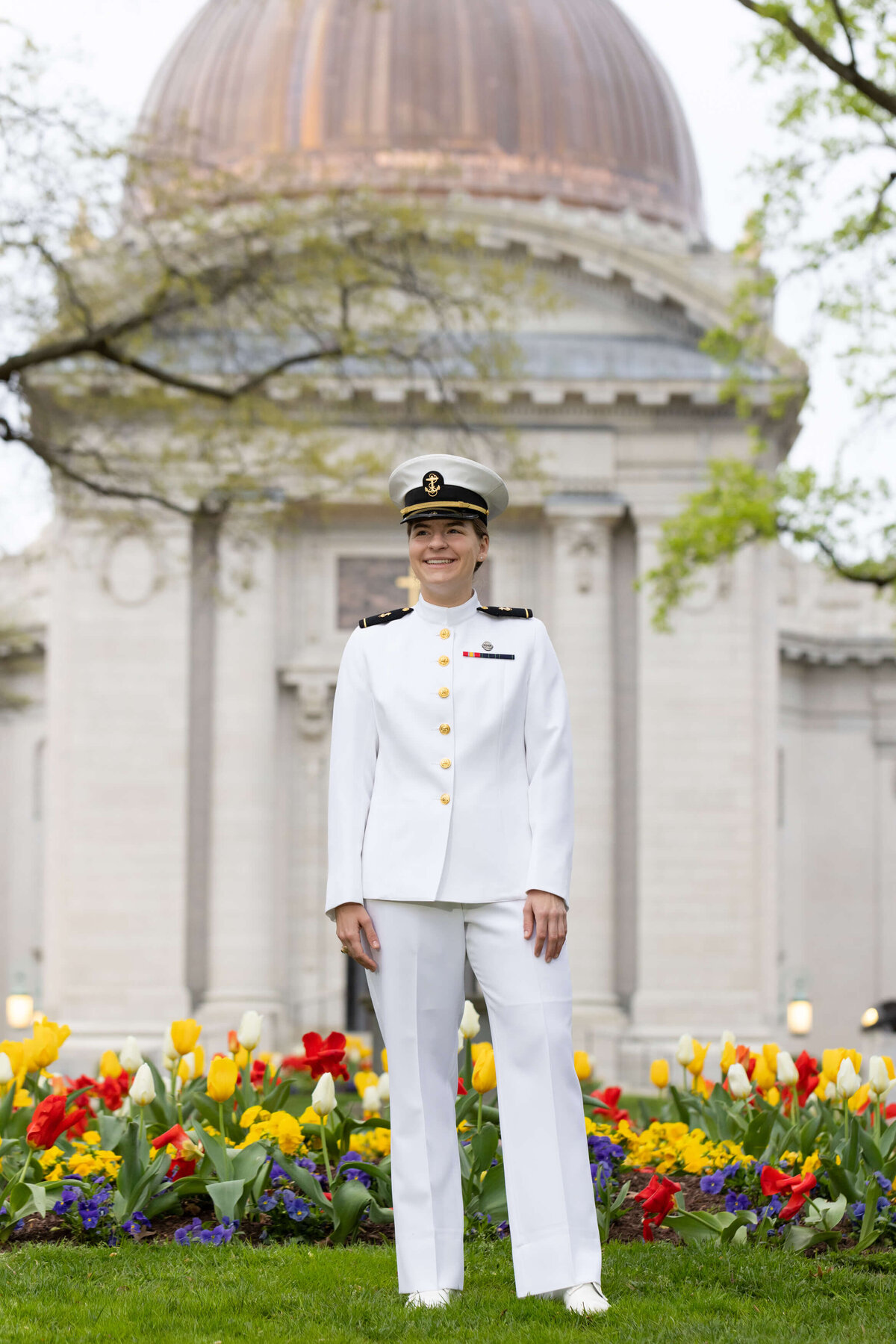 Naval Academy Chapel dome and tulips with graduate in choker whites uniform portrait.