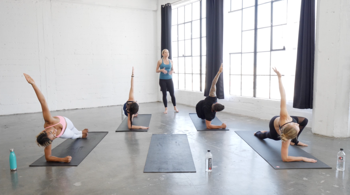 Nicole Duke leads hot pilates teacher training to 4 students on yoga mats