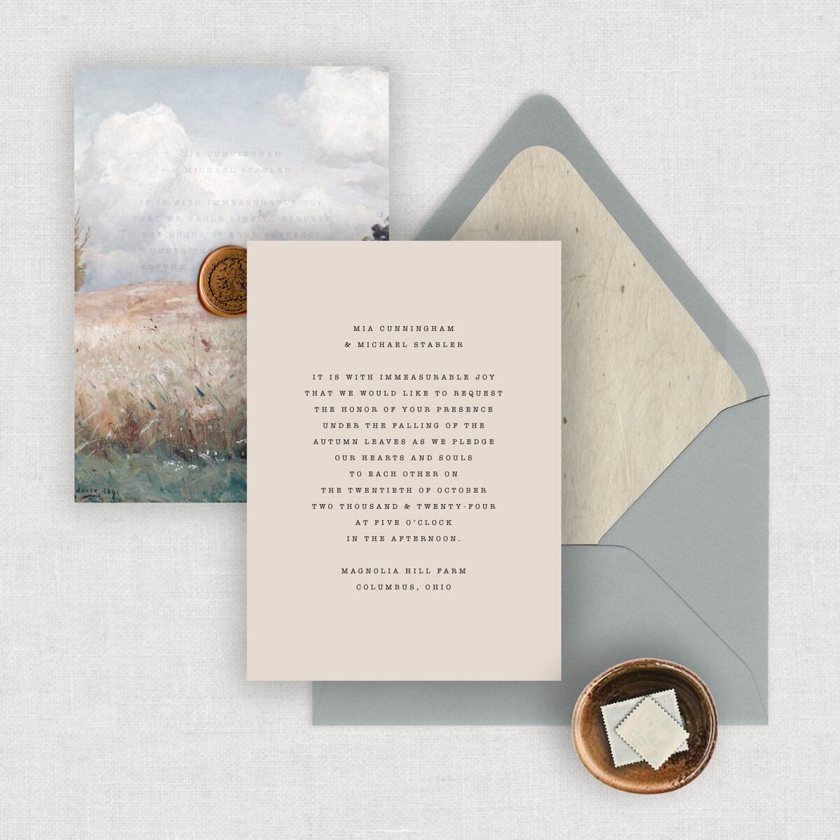 Typewriter wedding invitation suite is a simple wedding invitation with printed vellum invitation wrap and a copper wax seal.