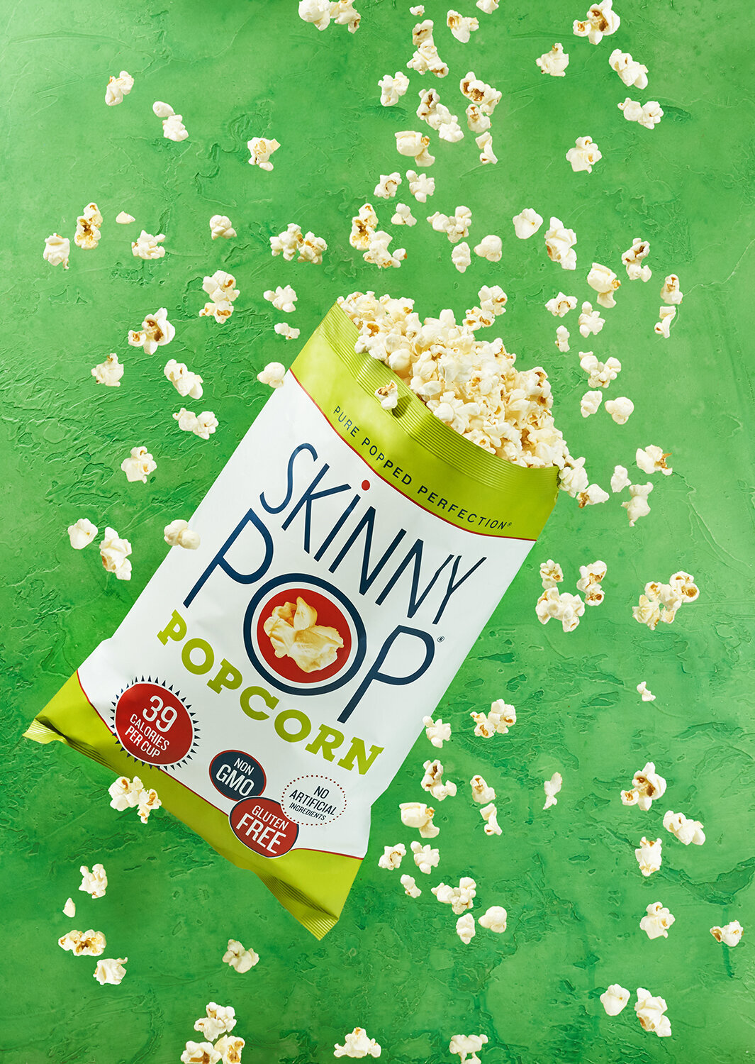 skinnypop popcorn bag popcorn explosion on green