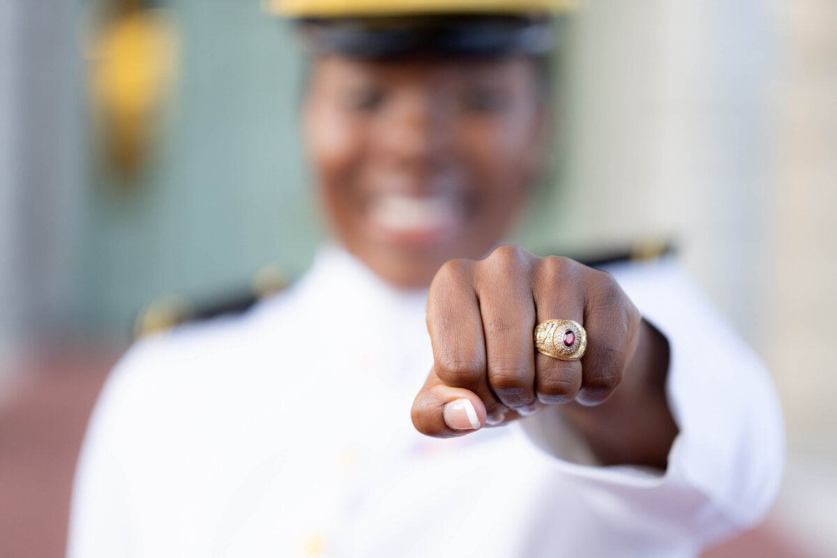 Naval Academy graduate displays class ring.