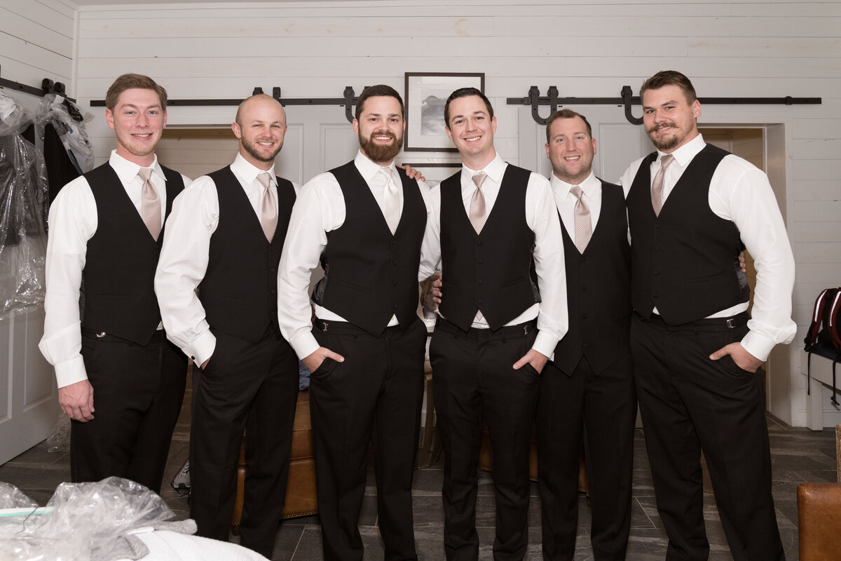 Group shot of the groomsmen as they prepare for the wedding day.