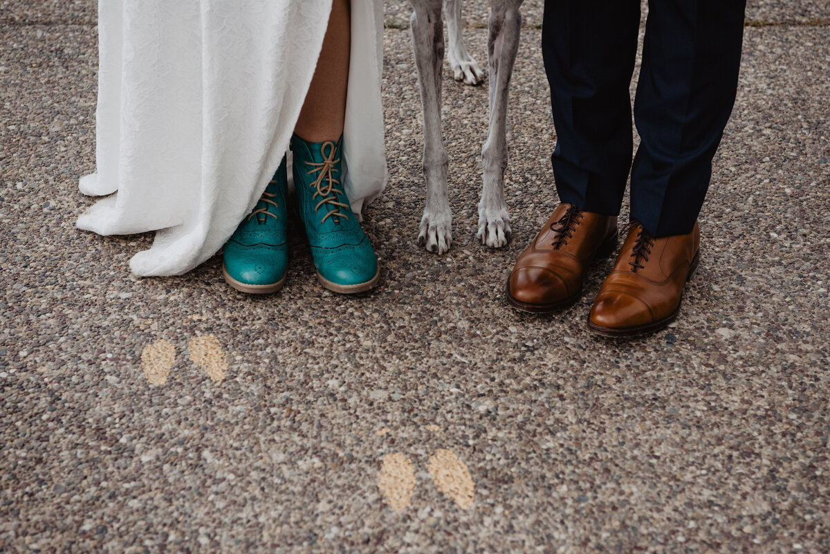 Photographers Jackson Hole capture bride, groom, and dog's feet