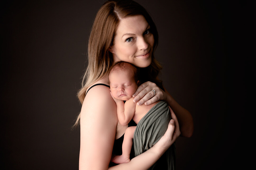 Newborn Baby held by mom +By For The Love of Photography.jpg
