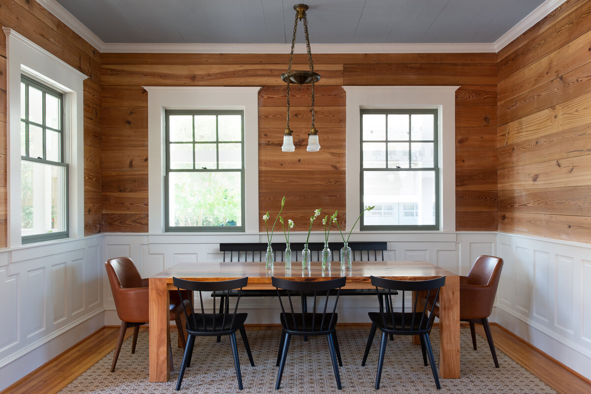 Traditional wood panel and white wainscot dining room