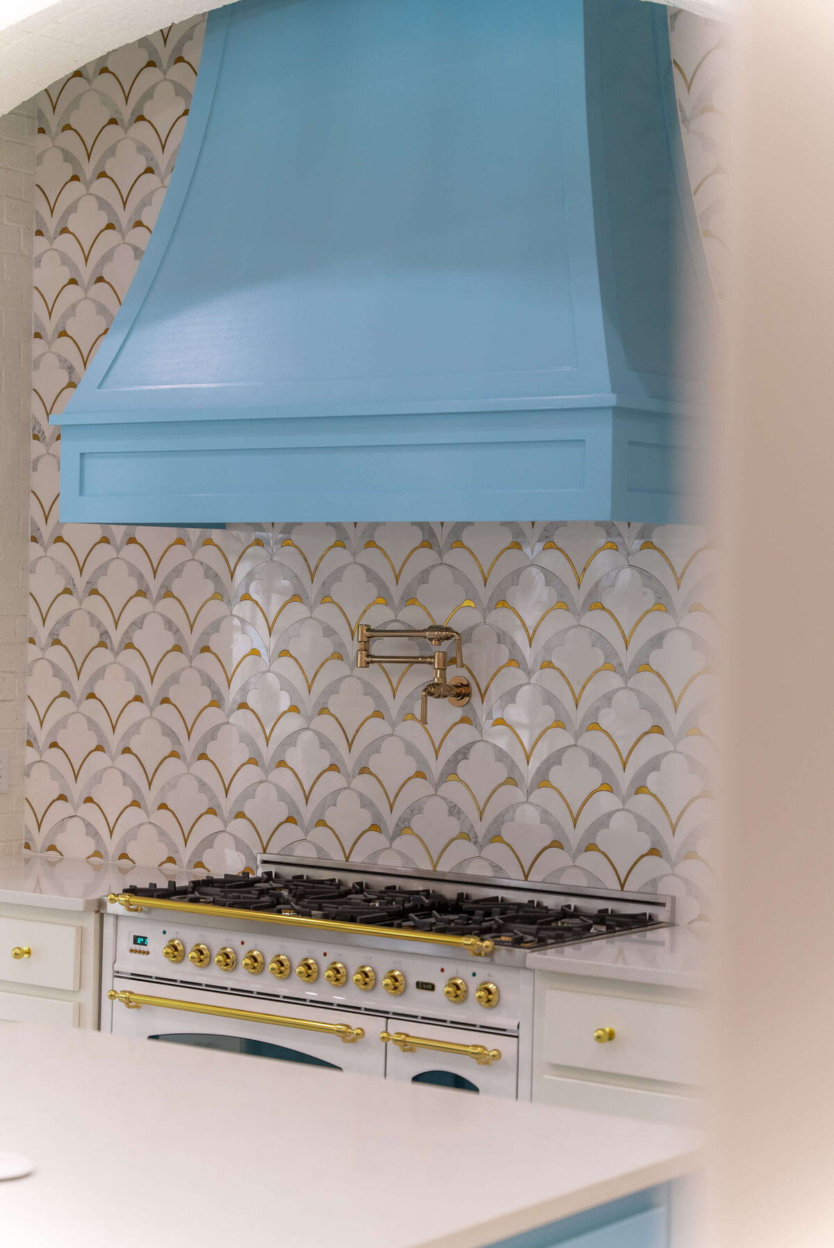 High-end colorful kitchen with bold patterns and gold accents