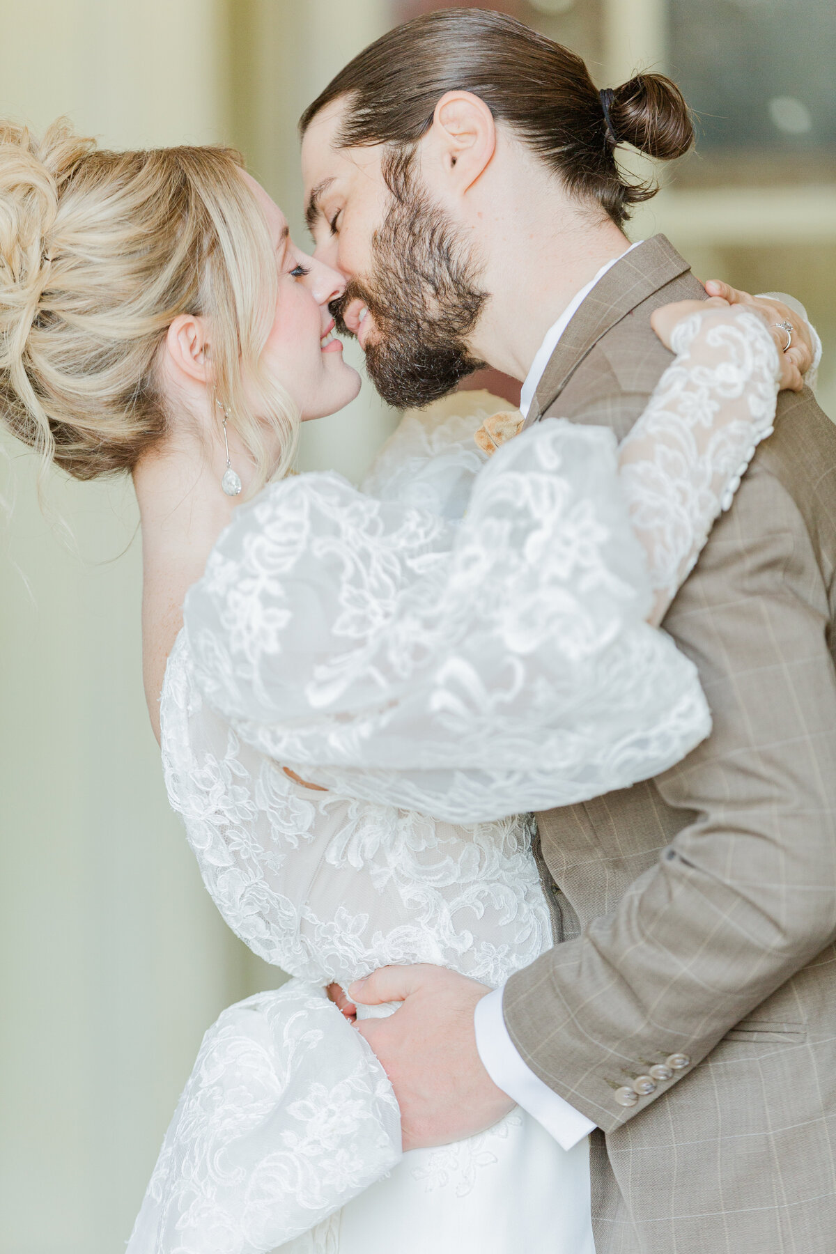 Close up image. Bride and groom share a kiss during couples photos at their North Shore Boston Wedding. Captured by Lia Rose Weddings, New England and Destination Wedding Photographer