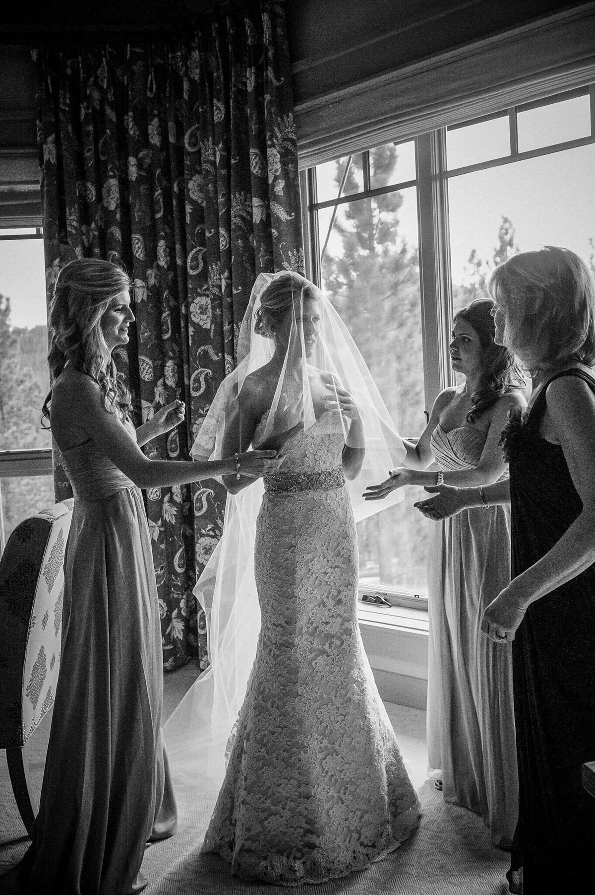 bride gets ready with her sisters and mother at wedding in martis Camp black and white image