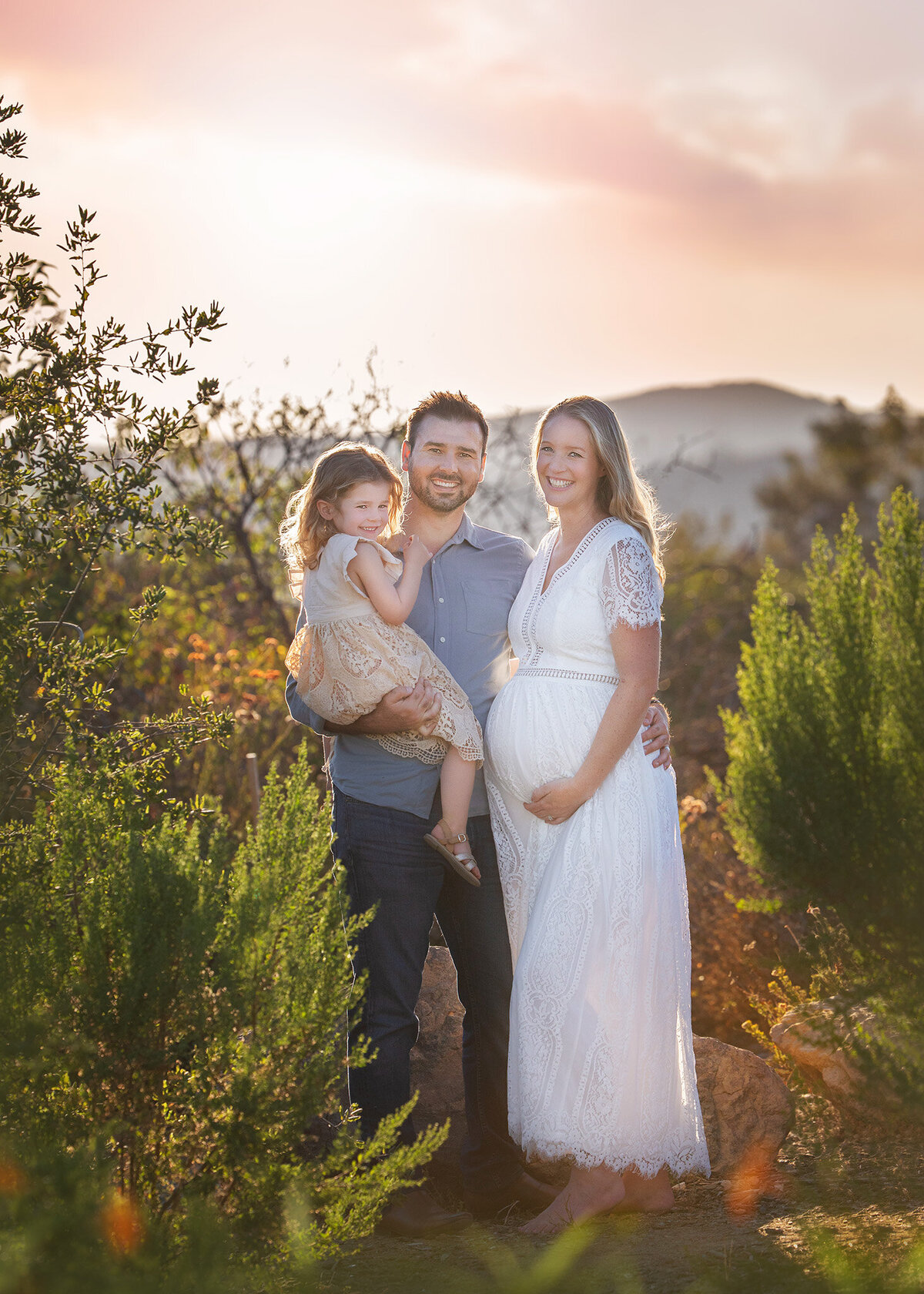 Family of three and baby bump at a maternity photoshoot in Los Angeles
